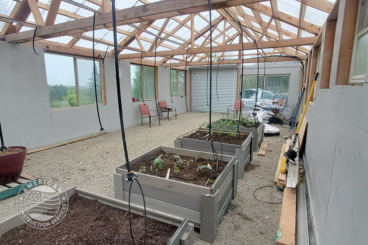 interior of newly constructed greenhouse built using 50% repurposed building material. Built by American Construction Services, Corp. in Southwest Washington