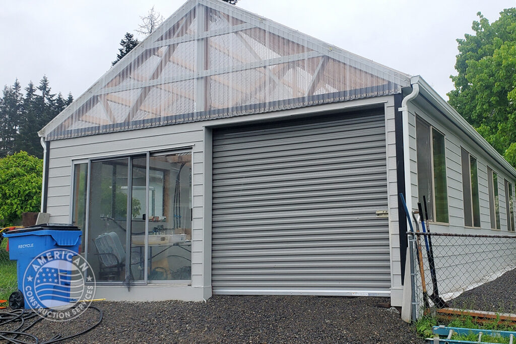 Exterior of newly constructed greenhouse built using 50% repurposed building material. Built by American Construction Services, Corp. in Southwest Washington