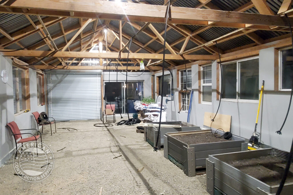 interior of greenhouse under construction using 50% repurposed building material. Built by American Construction Services, Corp. in Southwest Washington