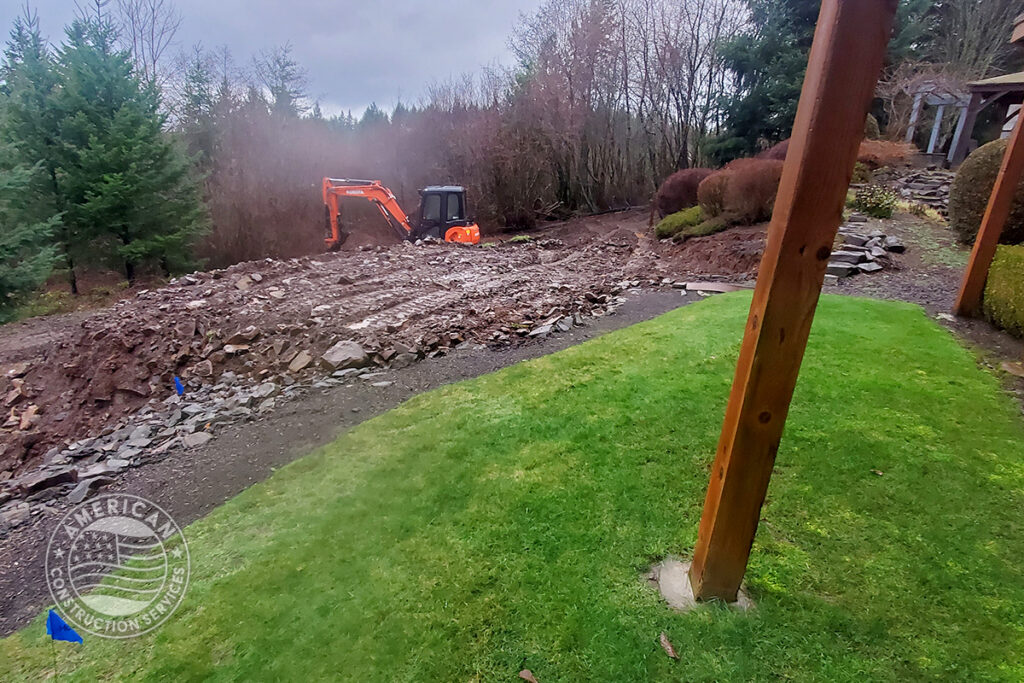 American Construction Services Corp Site prep for a swim spa. Includes dirt work, retaining wall, underground electrical, heavy pad with rebar.