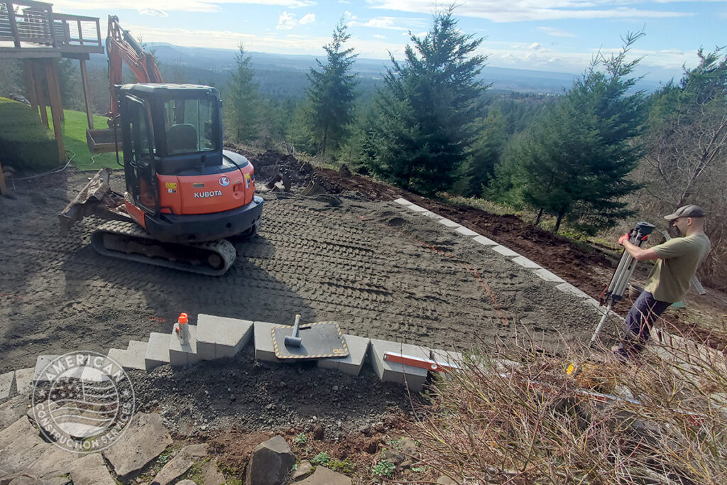 American Construction Services Corp Site prep for a swim spa. Includes dirt work, retaining wall, underground electrical, heavy pad with rebar.