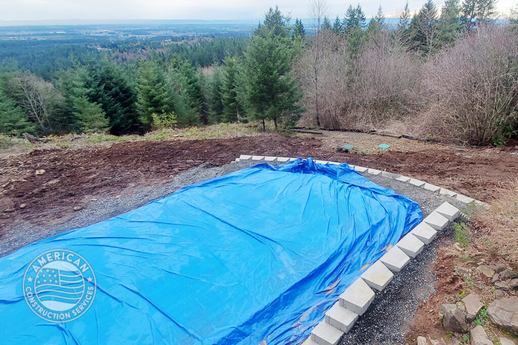 American Construction Services Corp Site prep for a swim spa. Includes dirt work, retaining wall, underground electrical, heavy pad with rebar.