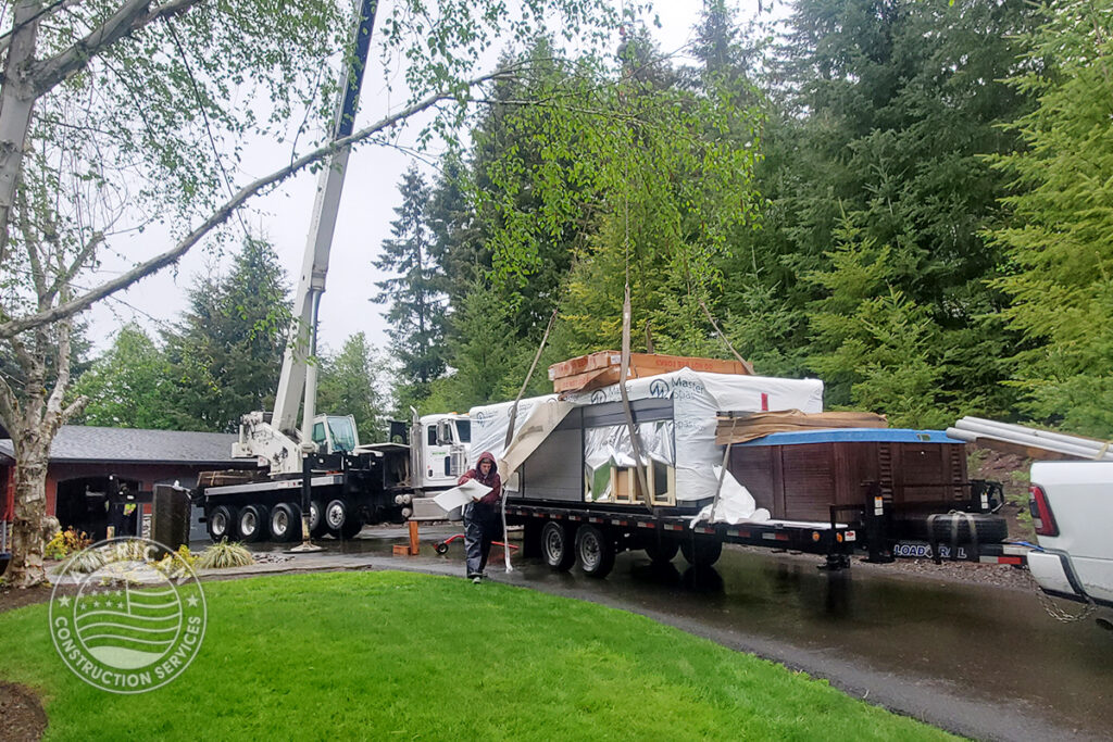 American Construction Services Corp Site prep for a swim spa. Includes dirt work, retaining wall, underground electrical, heavy pad with rebar.